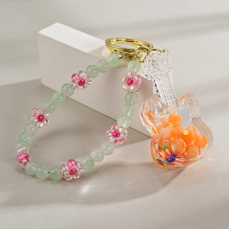 Wholesale Acrylic Oil in Quicksand Bottles, Luminous Violins, Beaded Chains, Keychains